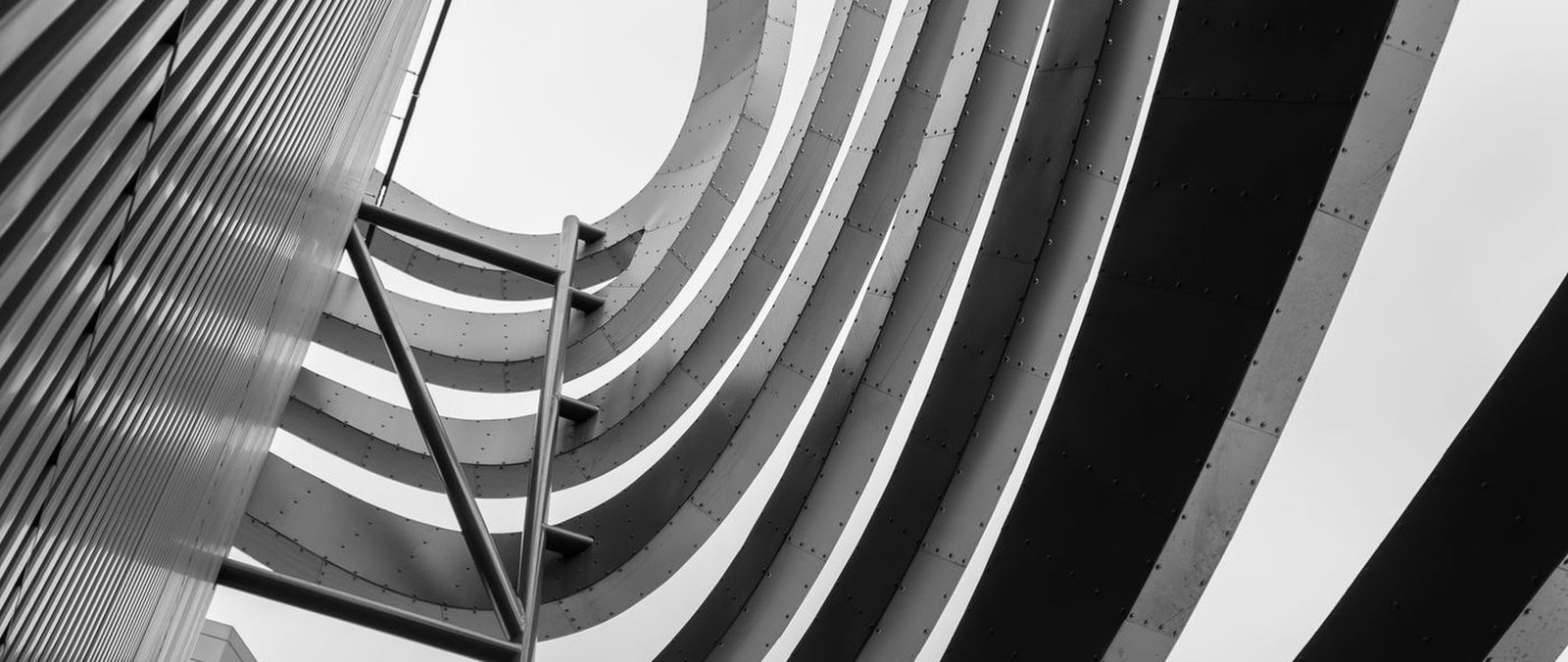 Spiral staircase photographed from above in black and white