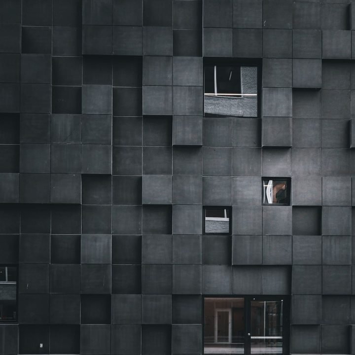 Dense modular concrete facade of stacked cubic elements
