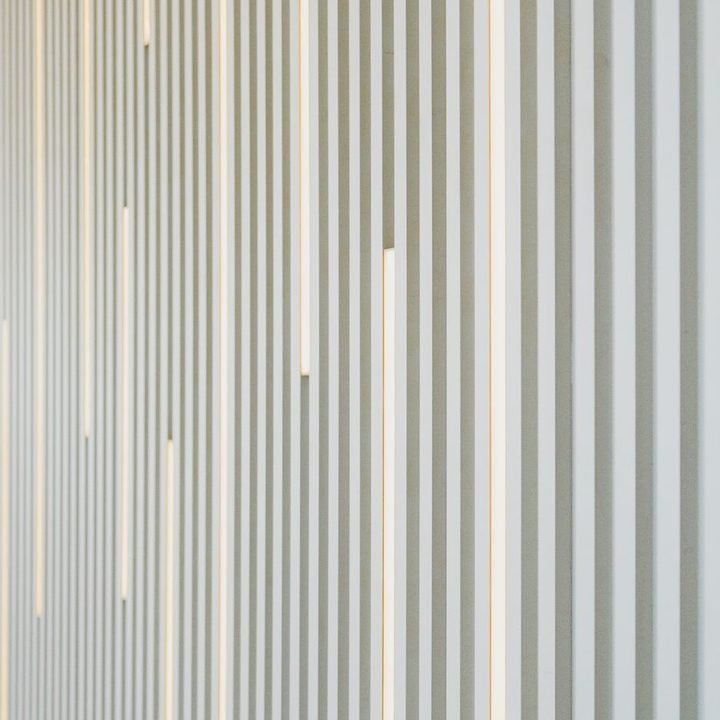 Vertical louvred screen in soft neutral tones